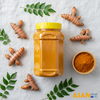 Adding authentic Afghan turmeric powder to a traditional curry dish for natural color and rich flavor.