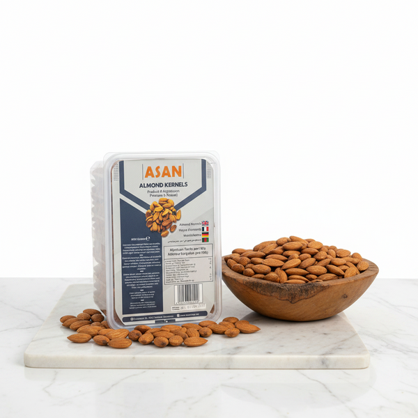 Open premium gift box showcasing uniform golden-yellow raw Abdul Wahidi Badam almonds